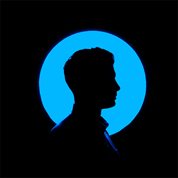 Silhouetted figure against blue circle